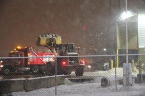 Road salt being loaded onto a salt truck at the VDOT facility on Columbia Pike