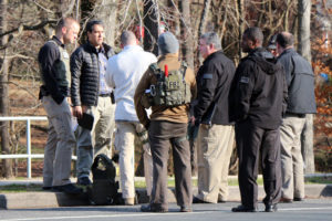 FBI agents on the scene of a bank robbery at the Wells-Fargo on S. George Mason Drive