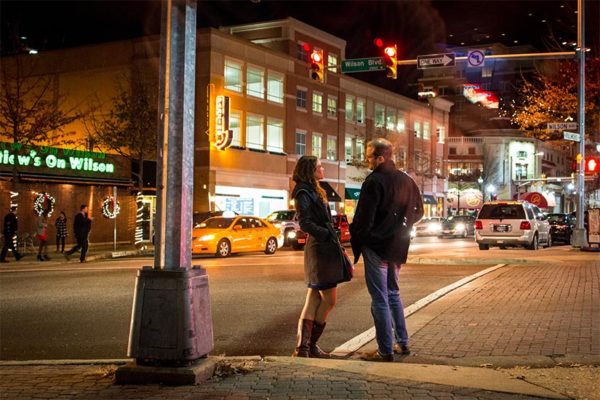 Two people talking on a Clarendon sidewalk (Flickr photo by Ddimick)