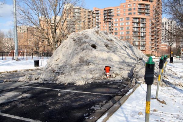 Large snow pile in the parking lot for Virginia Highlands Park