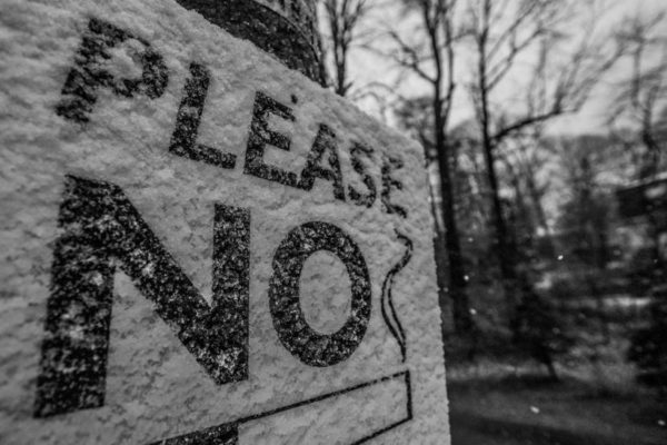 "Please No Smoking" sign in the snow on 3/30/14 (Flickr pool photo by Wolfkann)