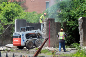 Workers tear down part of The W&OD trestle in East Falls Church
