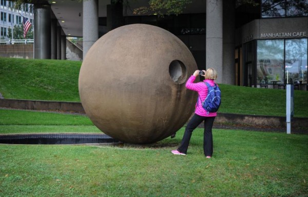 A woman photographs Dark Star Park in Rosslyn (Flickr pool photo by John Williams)