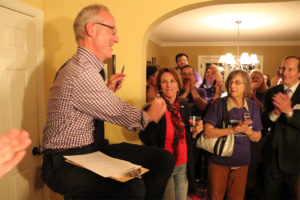 John Vihstadt high-fives fellow County Board member Libby Garvey at his election party Nov. 4, 2014