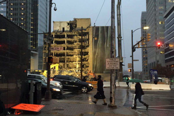 A building in the midst of being torn down on a rainy day in Rosslyn
