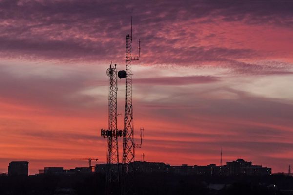 Radio antennas in South Arlington at sunset