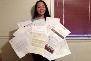 Brandi Moore with her 13 college acceptance letters