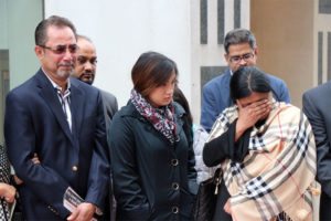 Chowdhury Saqlain's father, left, and his mother, right, after his killer's sentencing hearing