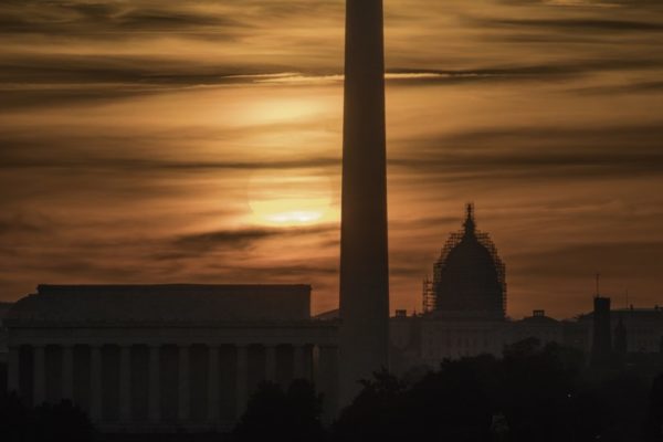 D.C. sunrise, as seen from Arlington (Flickr pool photo by Kevin Wolf)