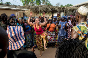 Sarah Lee Parker Mansare, leader of the Guinea trip, dances in the heart of inland Guinea (Courtesy of Megan Morrison)