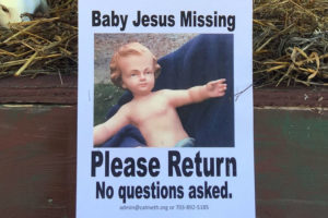 Close-up of missing baby Jesus sign