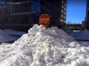 Snow piled in front of a stop sign during the January 2016 blizzard (photo via Arlington County)
