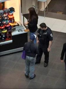 ACPD officer buying a man a hat at Pentagon City mall