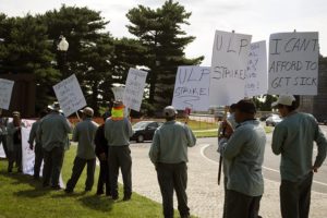 Groundkeepers on strike outside of Arlington National Cemetery in July 2016