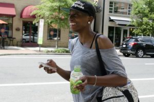 A woman enjoys a cold drink in Clarendon during the heat advisory on Thursday July 14, 2016