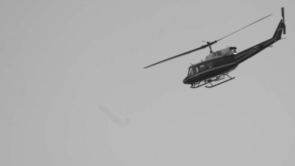 Government helicopter against a gray sky (Flickr pool photo by John Sonderman)